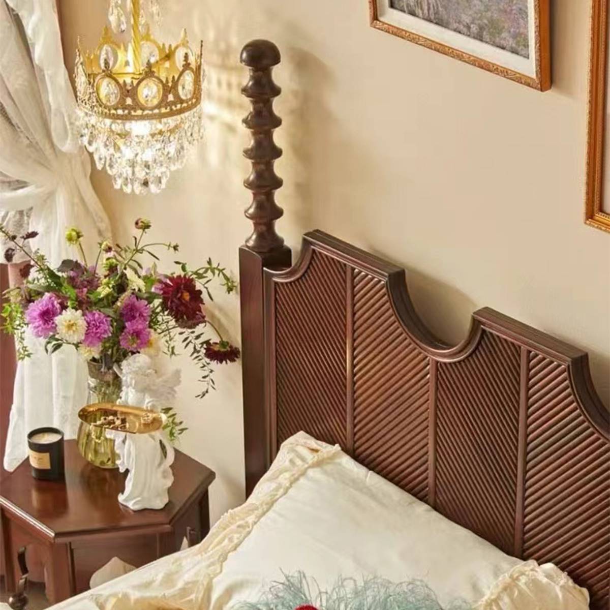 Close-up detail of the vintage brown bed's turned post and slatted headboard texture.