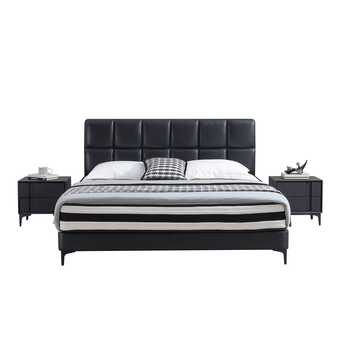 Front view of a black leather soft bed with a tufted headboard and matching bedside tables