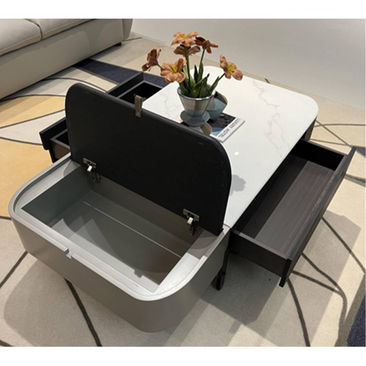 Top-down view showing the lift-top mechanism open, revealing the internal storage compartment and side drawer.