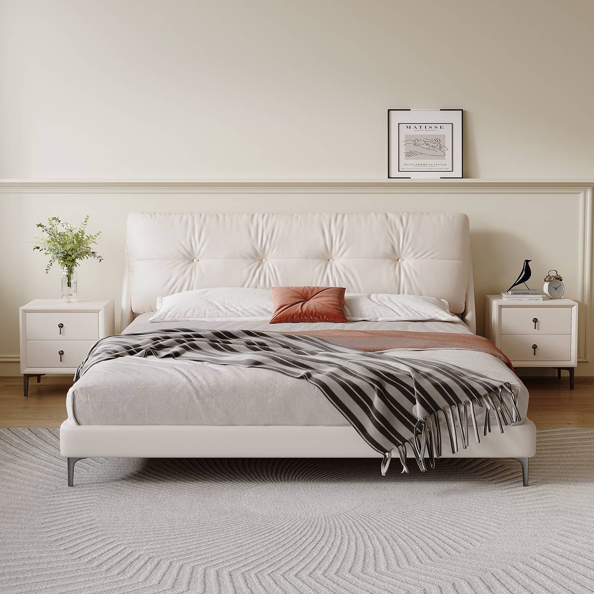 White mid-century modern upholstered bed with tufted headboard in a bedroom setting