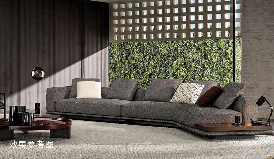 Dark grey modular sofa in a modern living room with a wooden side table and large window background.