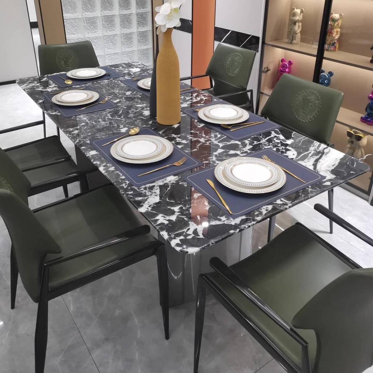 Close-up view of the Bulgari Black marble dining table set with tableware