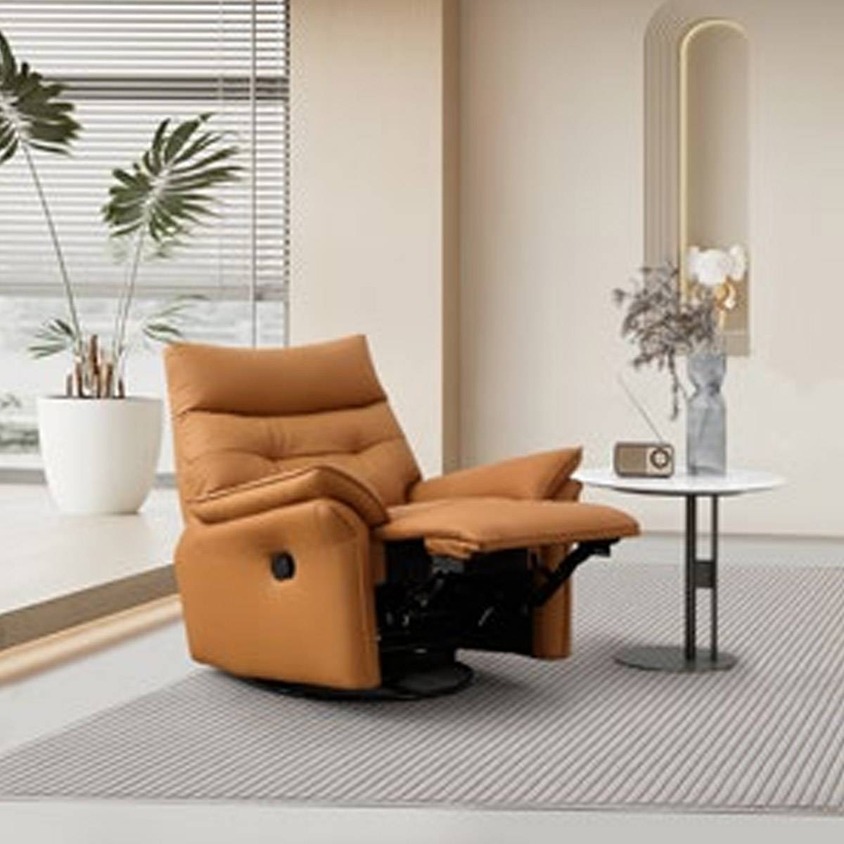 Tan leather recliner chair in fully reclined position showing footrest