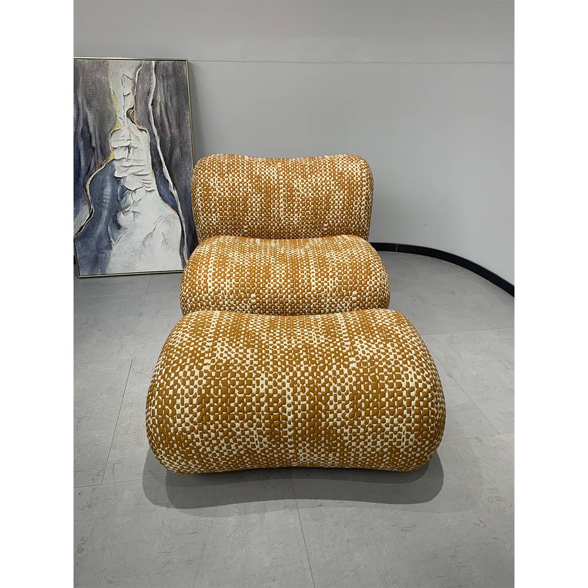 Front view of the modern lounge chair and ottoman set