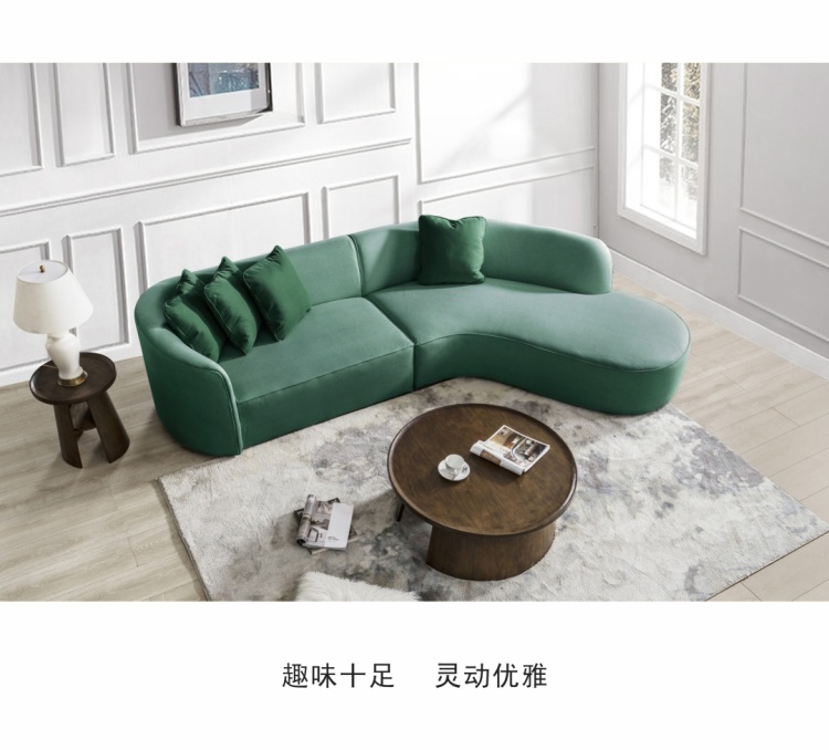 Green curved sofa from a high angle showing the layout with a coffee table