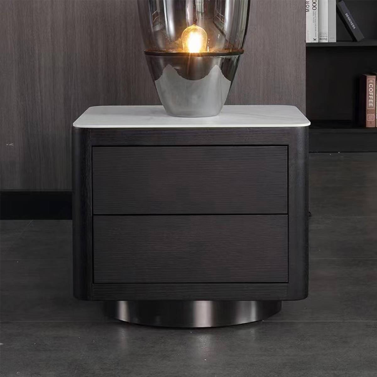 Close-up front view of the bedside table drawers and marble top