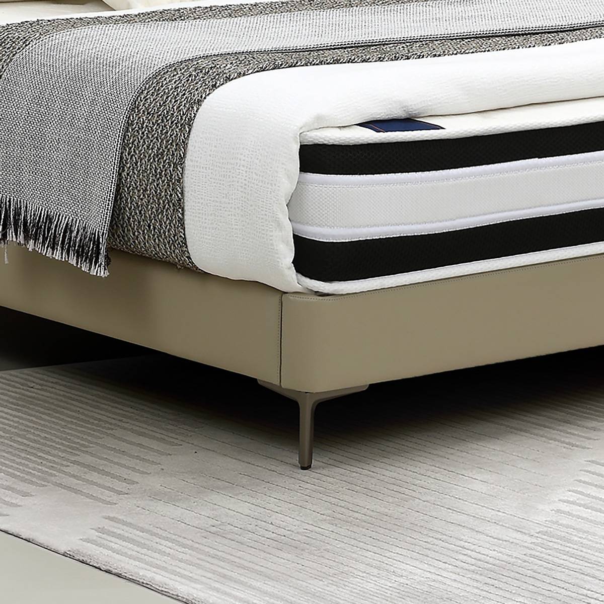 Close-up detail of the bed frame corner and metal leg
