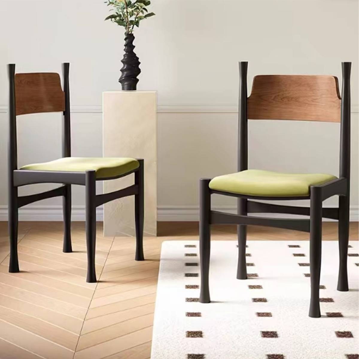 Side profile of the mid-century dining chair showing the black frame and green seat