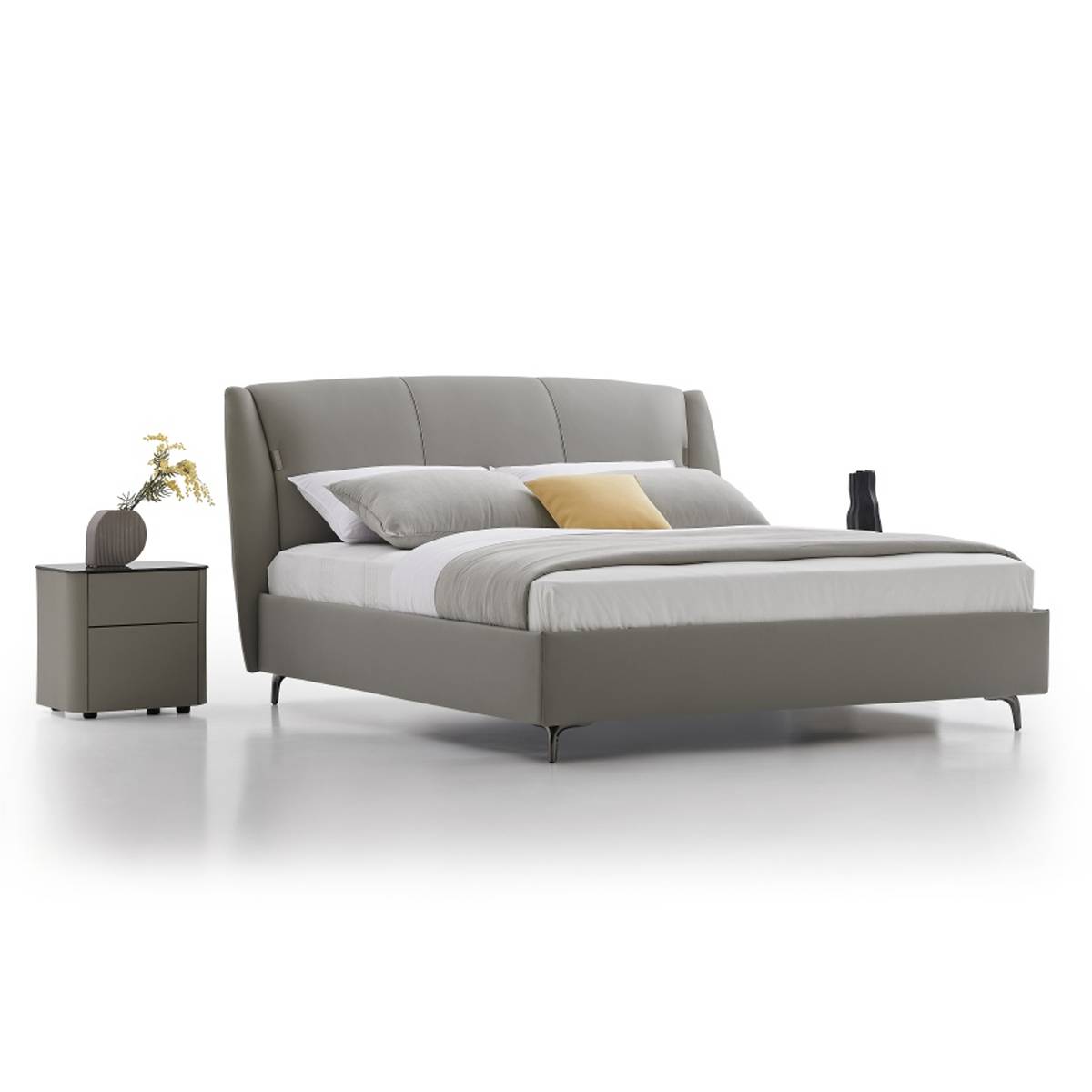 Side angle view of the grey cowhide bed showing the headboard and frame