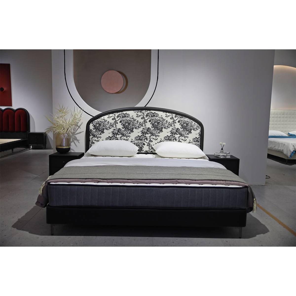 Front view of the bed showing the curved headboard and metal legs