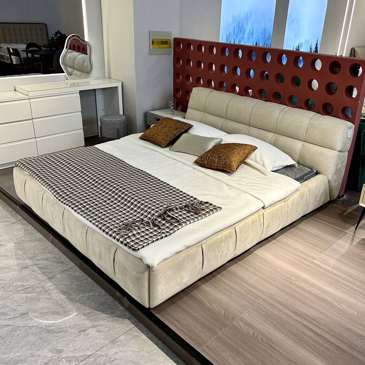 Wide angle view of the bed in a showroom setting