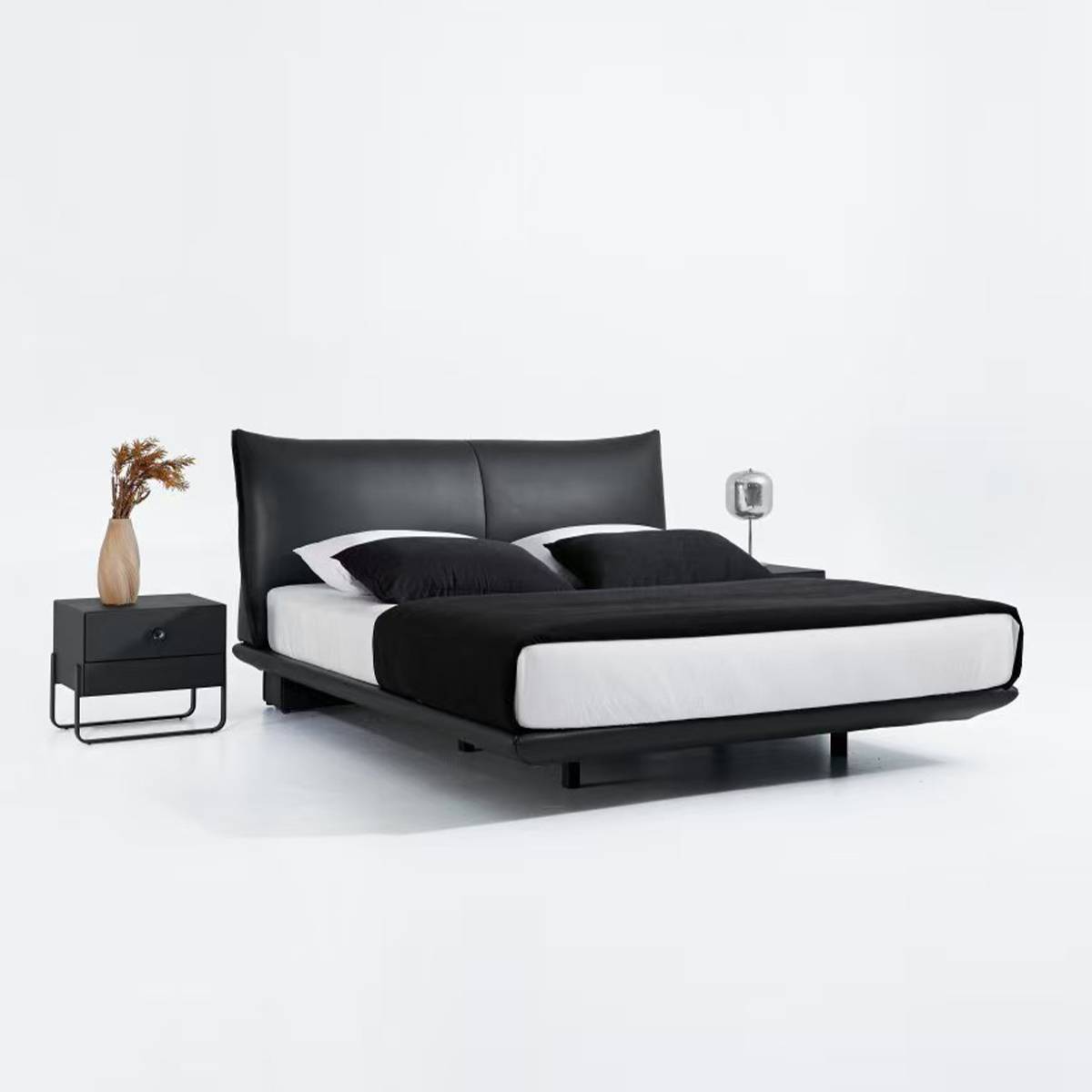 Side angled view of black leather floating bed