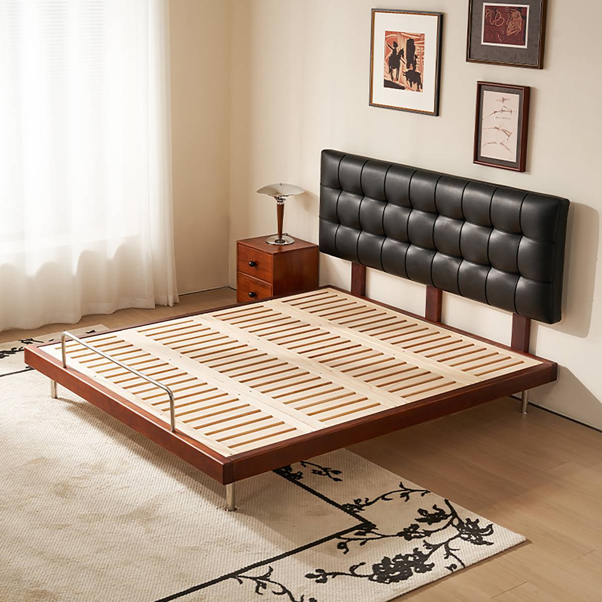 Bed frame showing wooden slats and metal legs without mattress