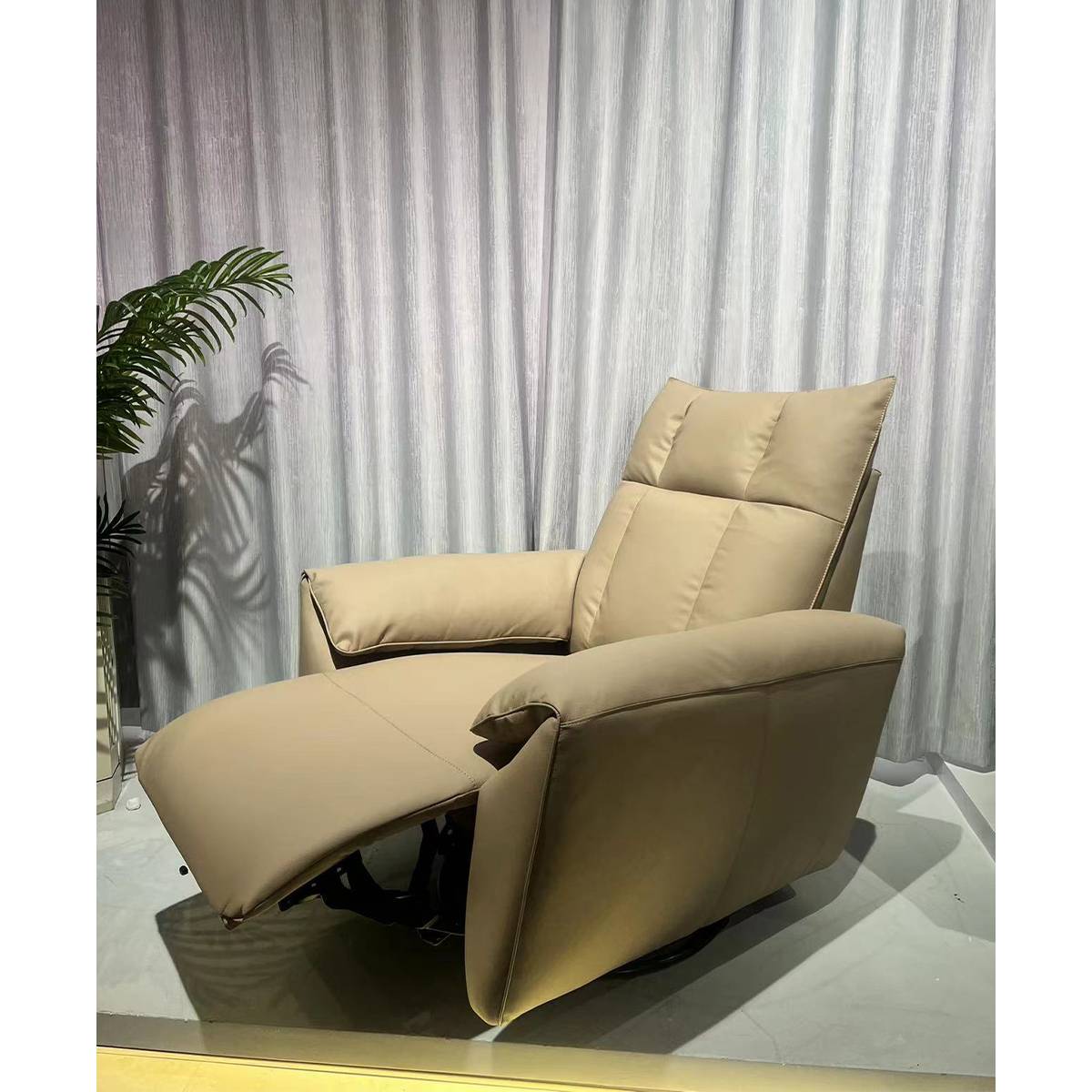Beige leisure chair in reclined position showing the extended footrest