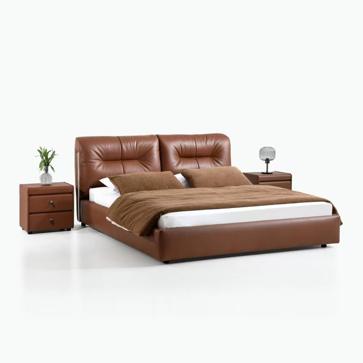 Angled view of brown leather bed with bedding