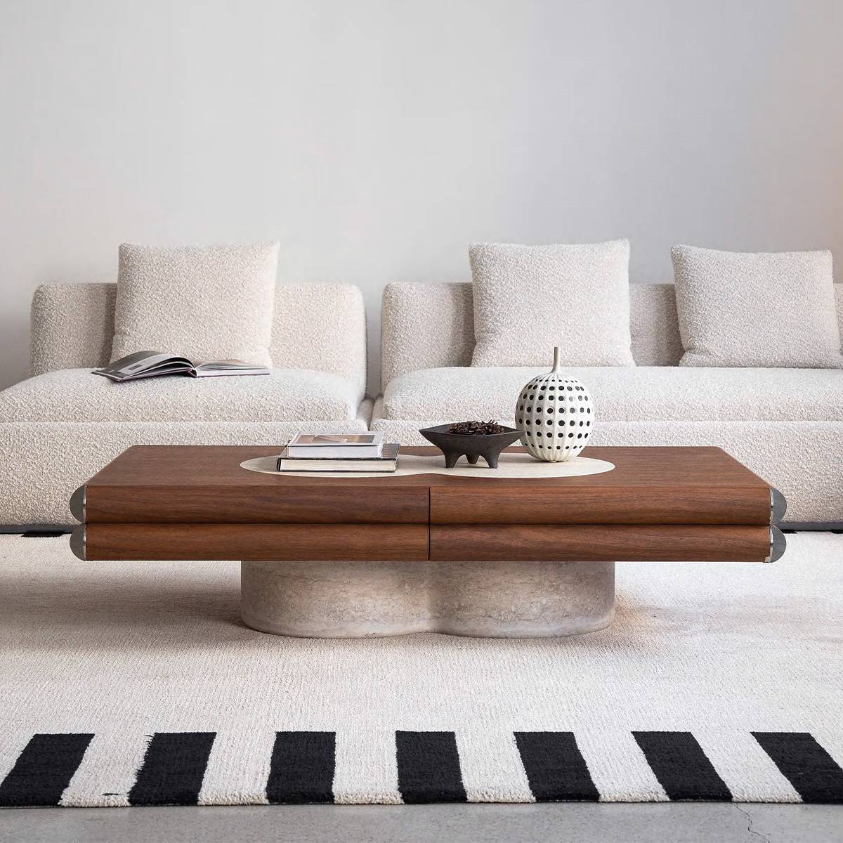 Lifestyle shot of the coffee table in a living room setting with a sofa and rug.