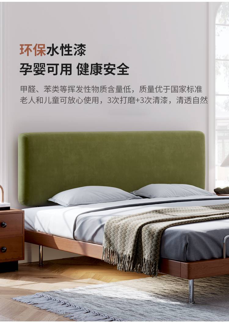 Full view of the bed with green headboard and white bedding in a bedroom setting