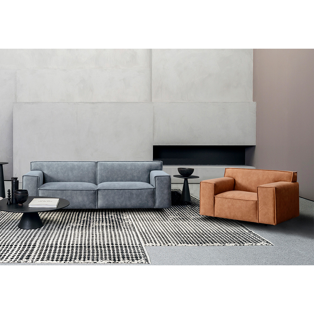 Lifestyle shot of the blue sofa in a modern living room setting with a brown armchair