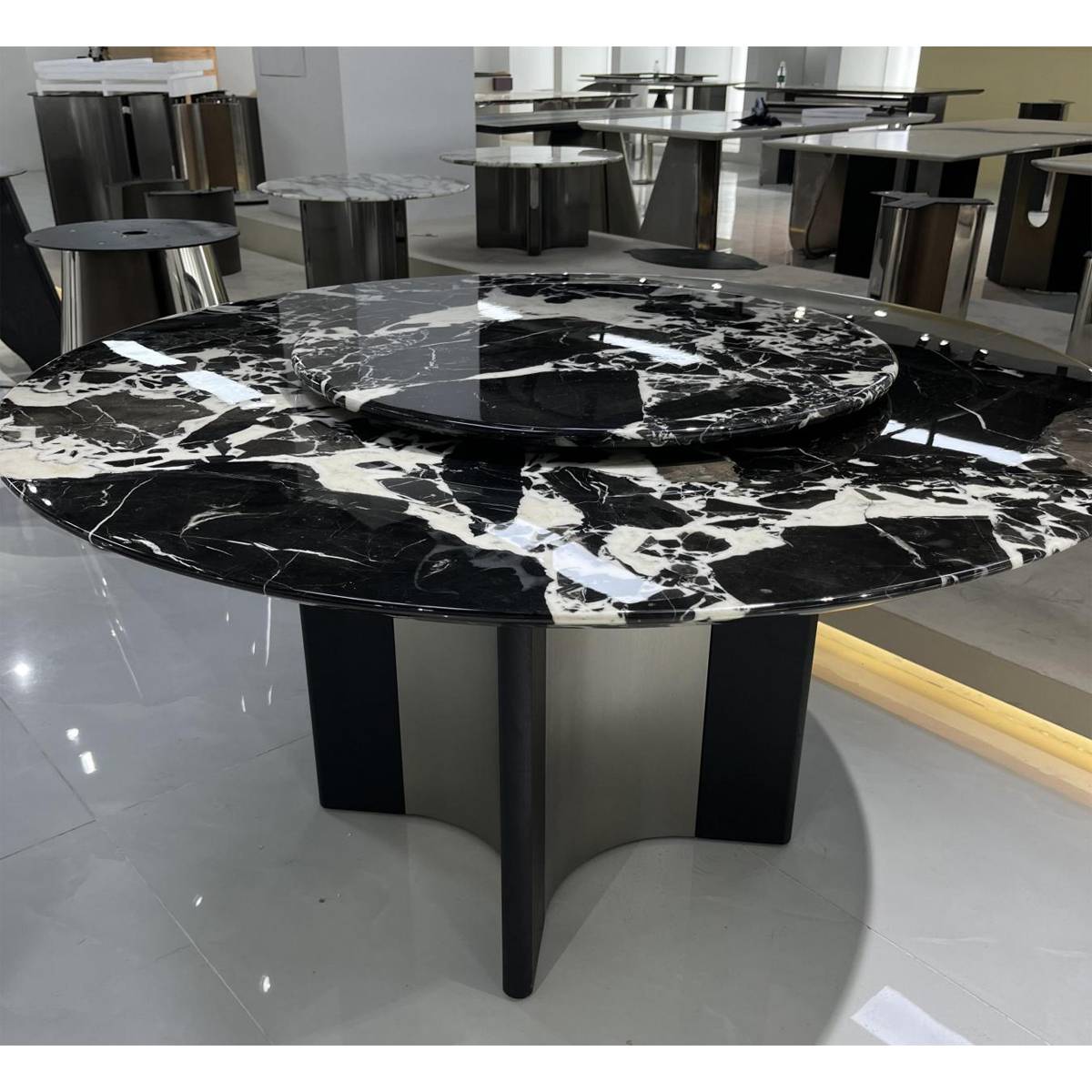 Showroom view of the Bulgari Black marble dining table highlighting the stone texture