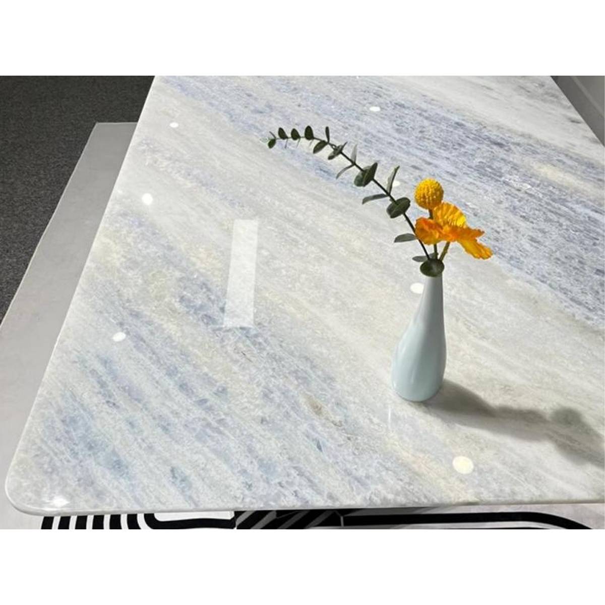 Close-up detail of the Blue Crystal marble tabletop surface showing texture and veining