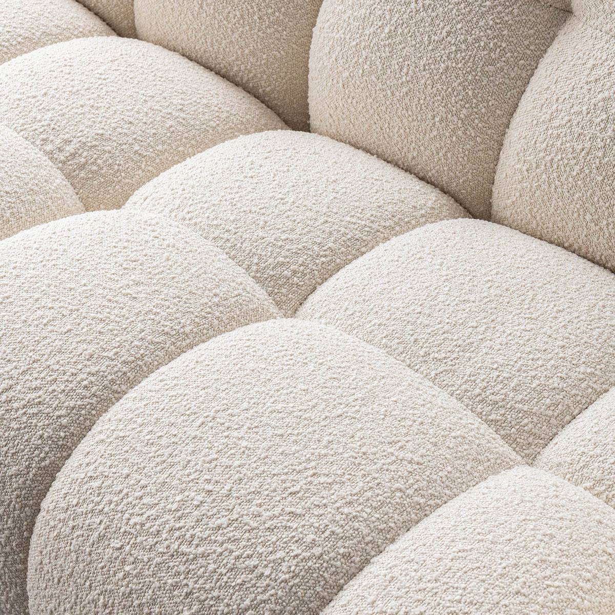 Close-up detail of the tufted seat cushions