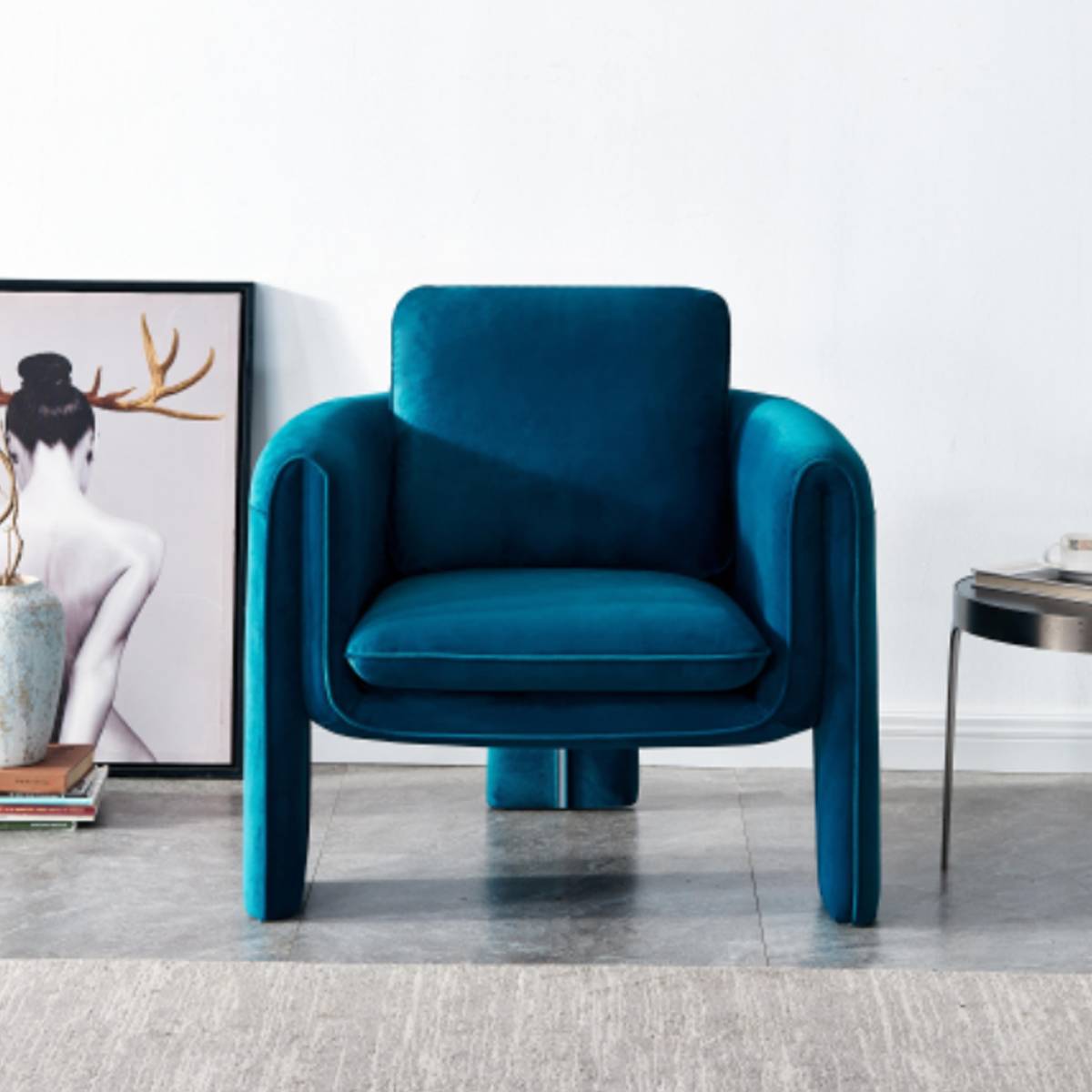 Front view of a teal velvet lounge chair