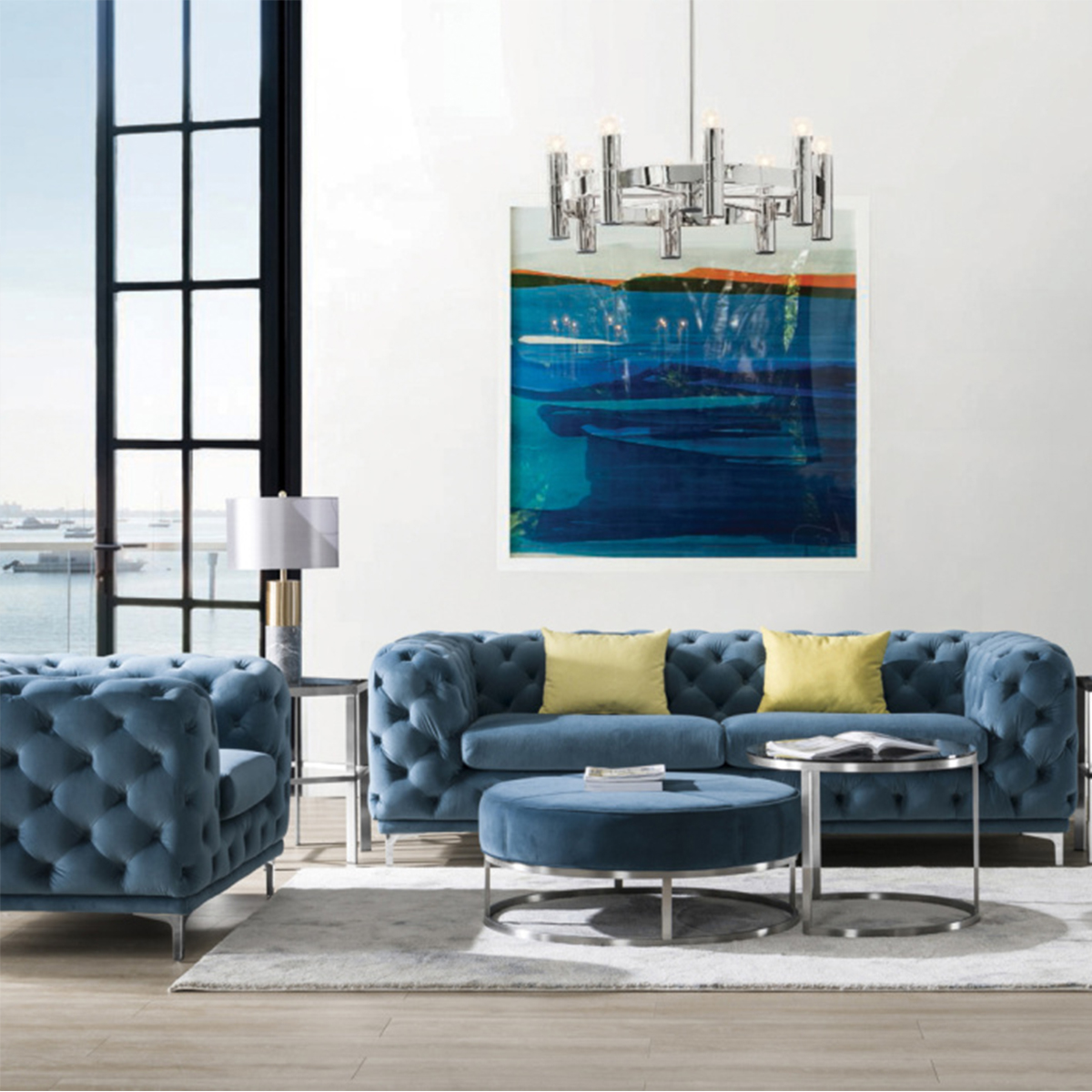 Blue tufted sofa set in a modern living room with yellow pillows