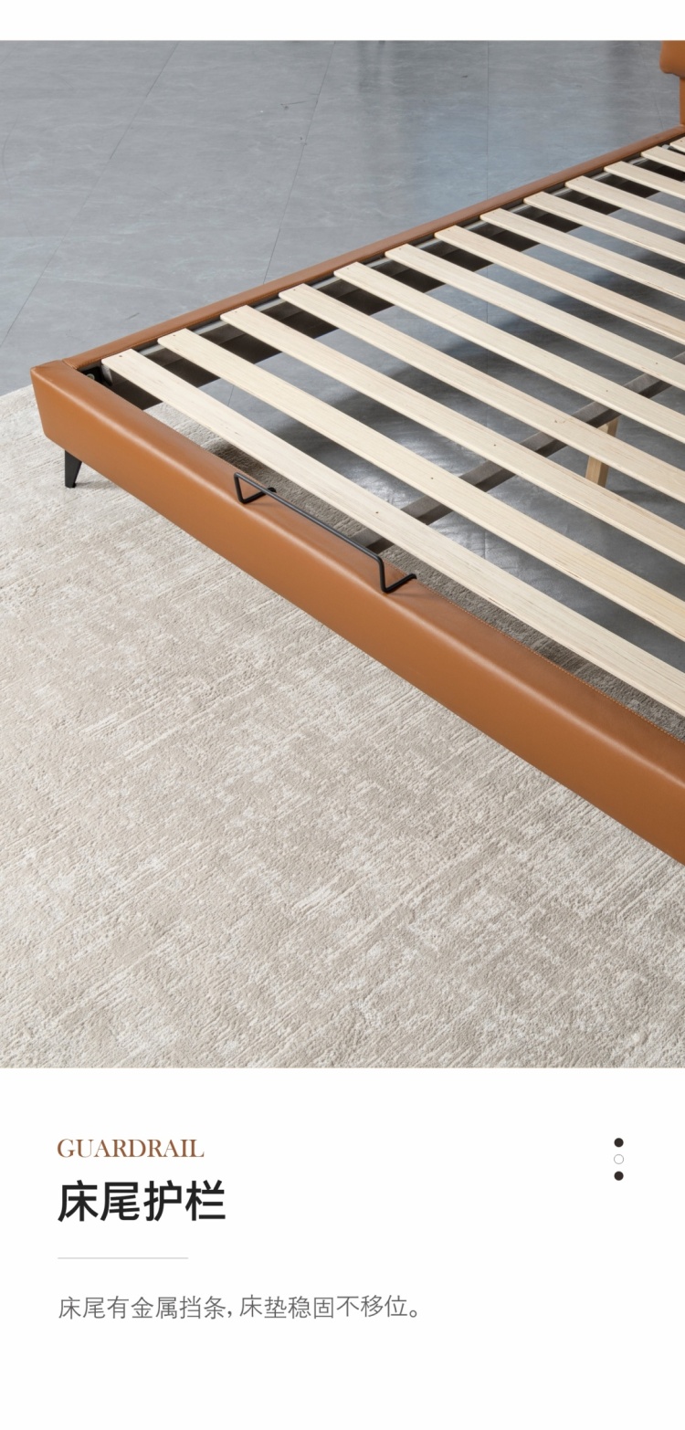 View of the bed frame slats and metal guardrail at the foot