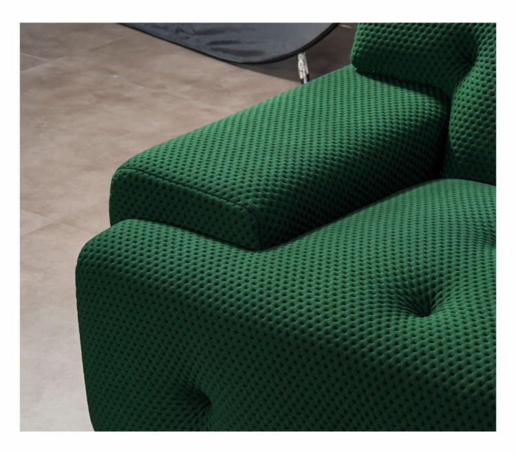 Close-up of the green 3D space cotton fabric texture on the sofa armrest