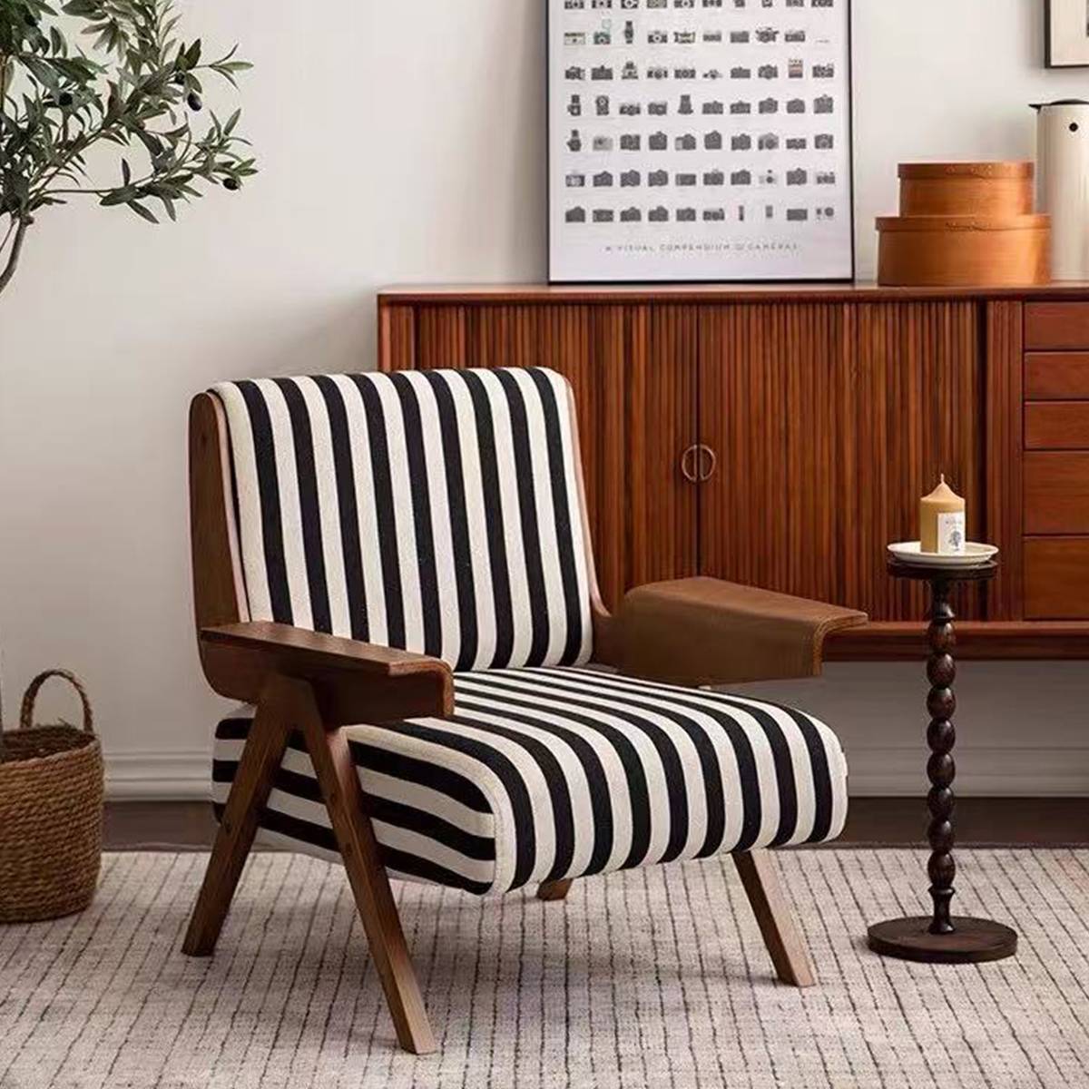 Lounge chair placed in front of a wooden sideboard