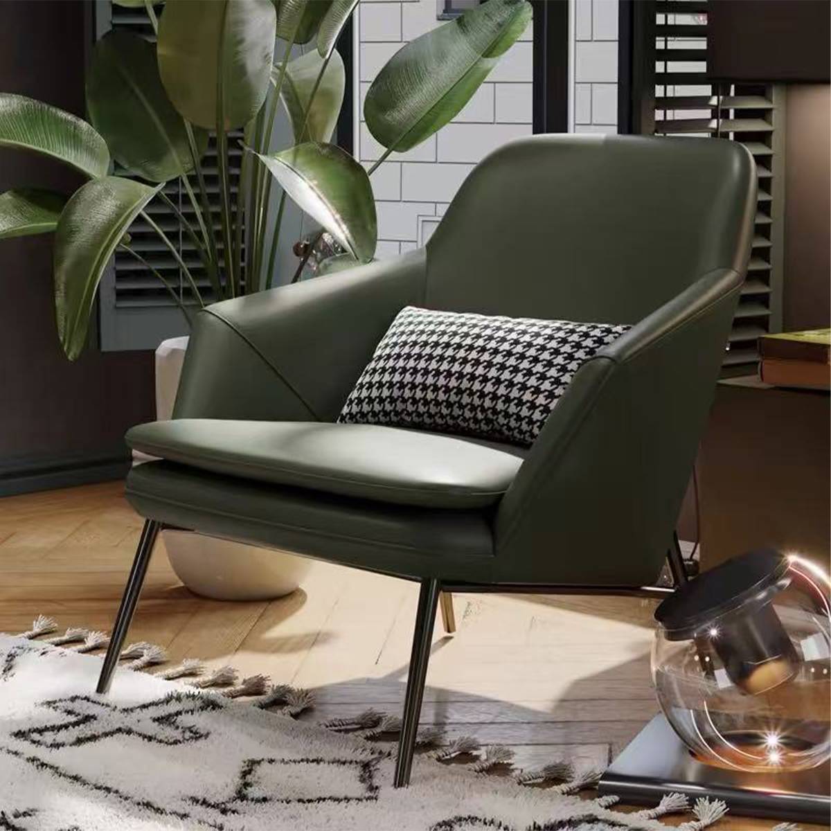 Side view of the green lounge chair showing the metal legs and cushion depth