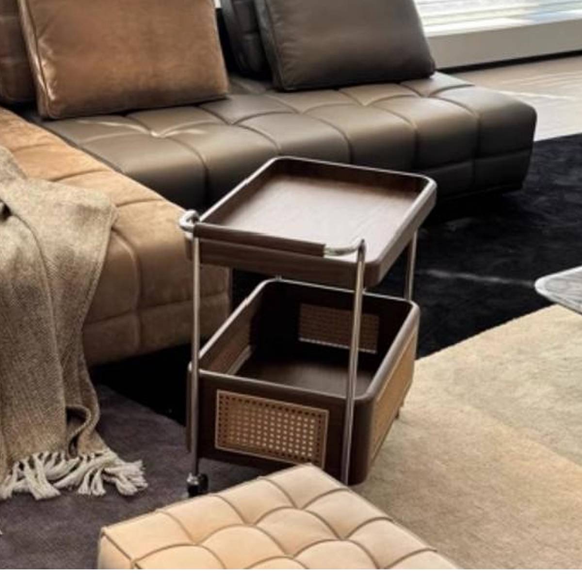 Side view of the serving cart side table showing the storage basket and wheels