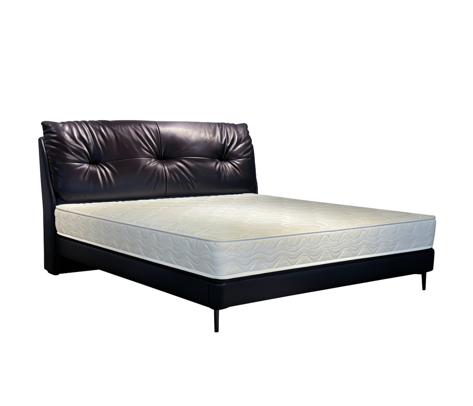 Black tufted leather bed frame with white mattress