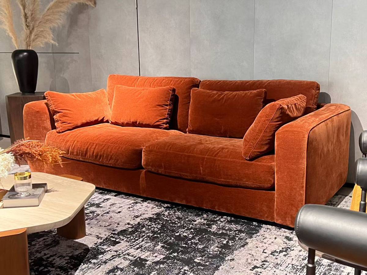 Close-up detail of the sofa's fabric texture and cushion construction