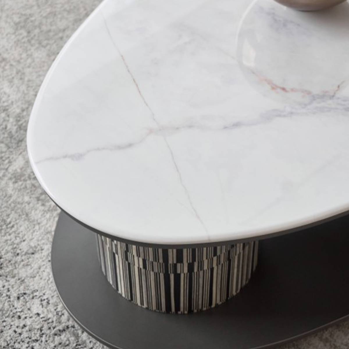 Top-down detail of the white marble-effect surface showing grey veining