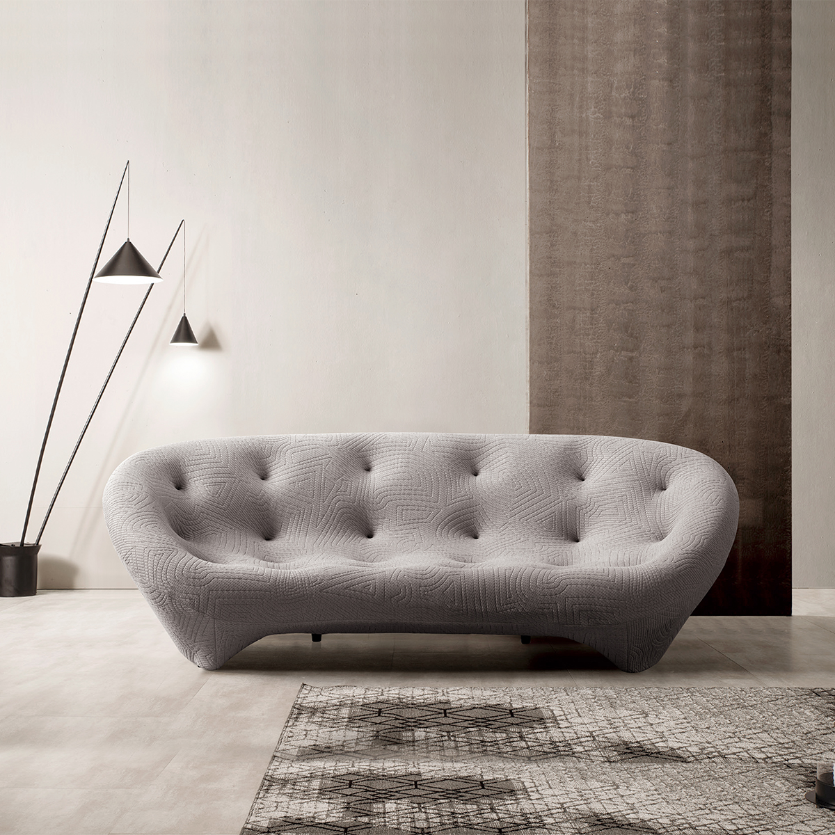 Grey shell sofa in living room setting
