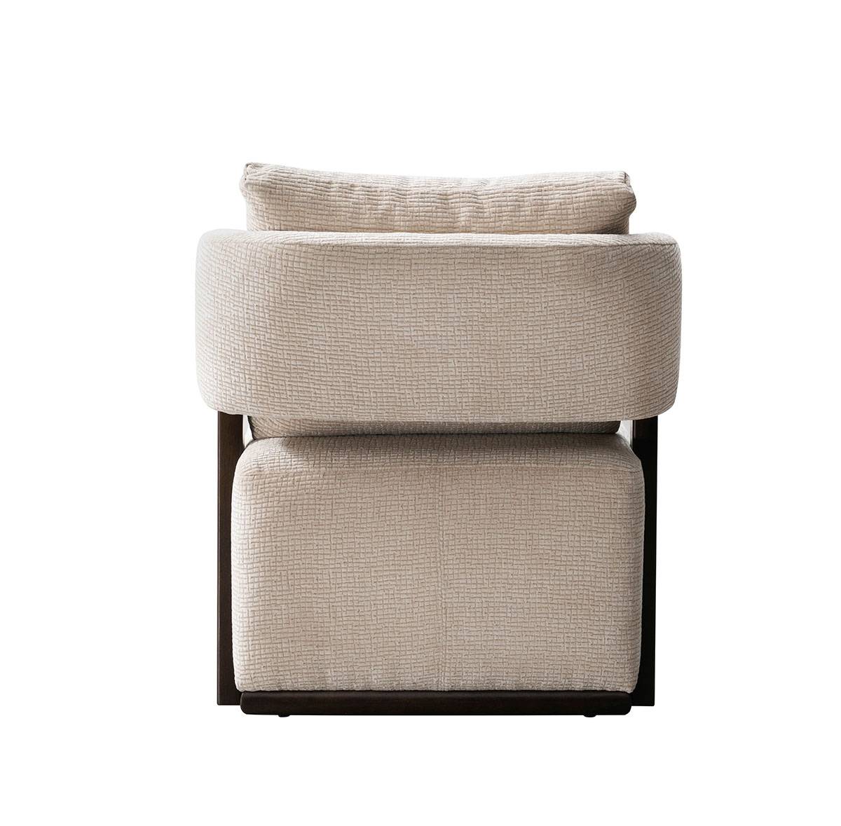Front view of beige upholstered lounge chair with dark wood frame