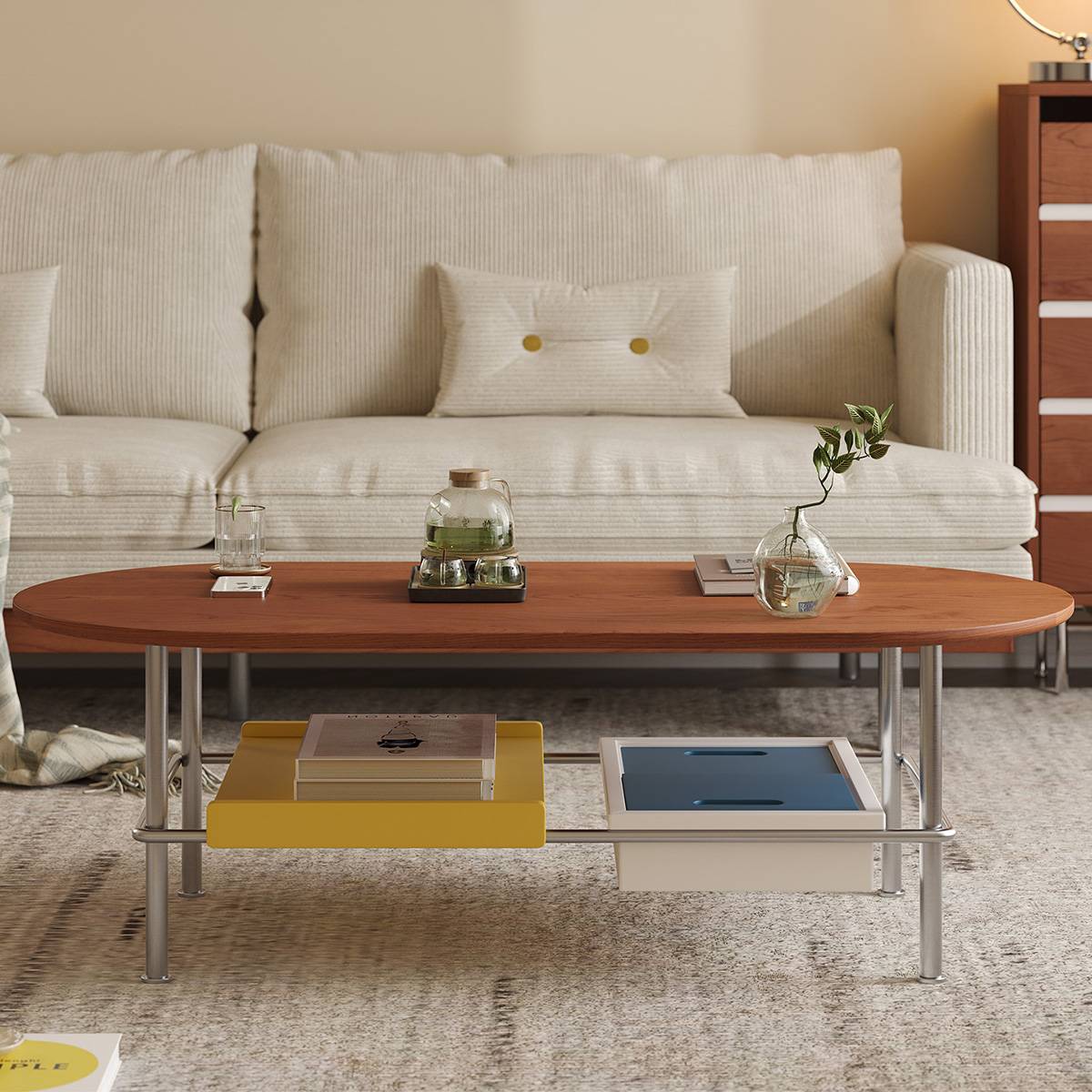 High-angle view of the oval coffee table with yellow and blue storage trays
