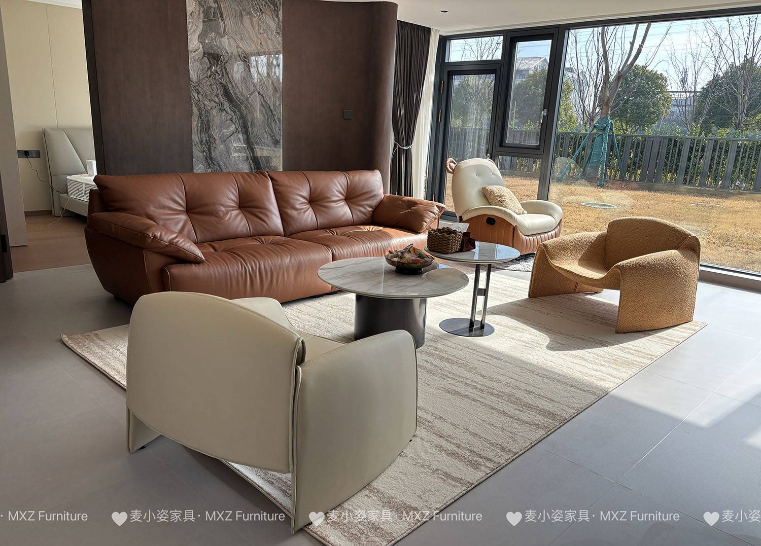 Living room setup with brown leather sofa and coffee tables