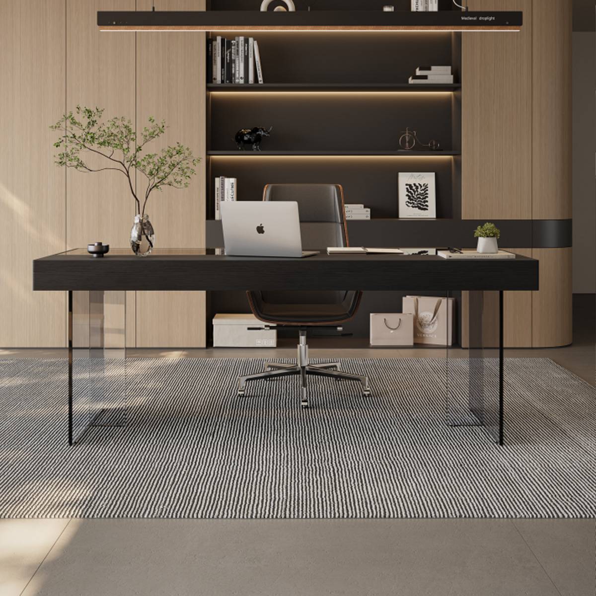 Front view of the black desk showing the laptop and office accessories