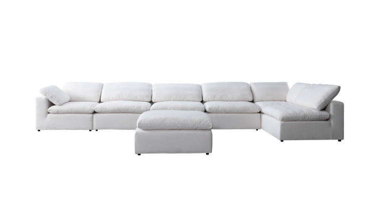 Front view of white fabric sofa with ottoman