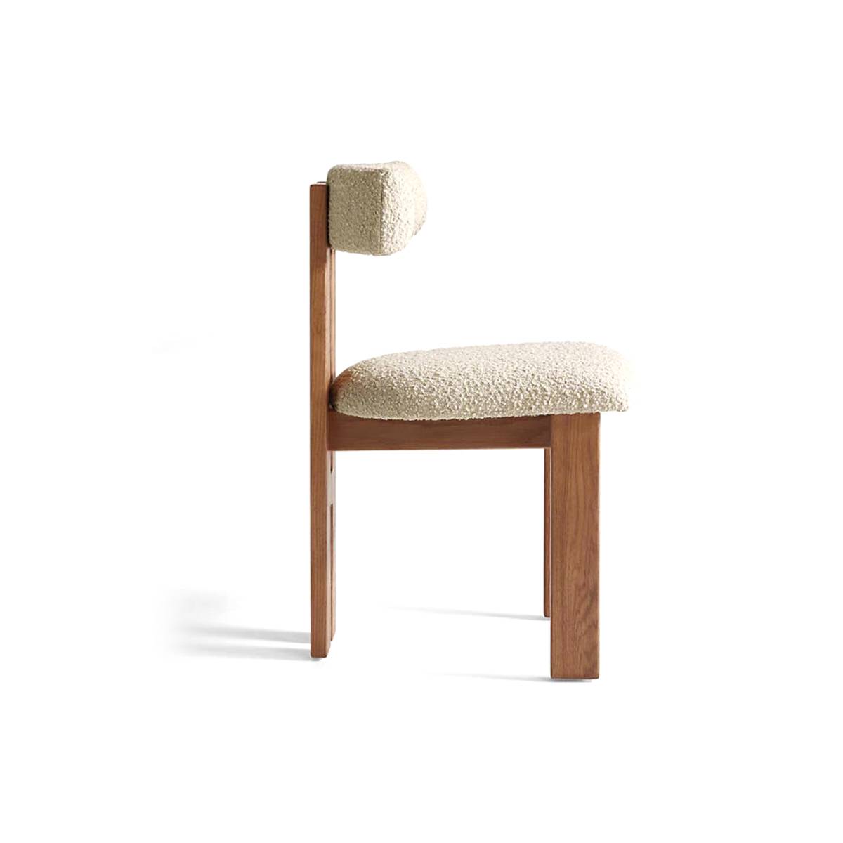 Walnut wood frame dining chair with beige bouclé upholstery side view