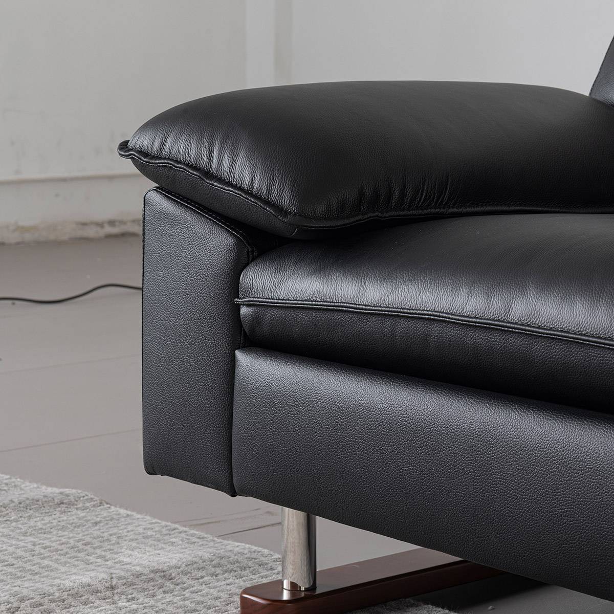 Side view of the sofa armrest and adjustable headrest
