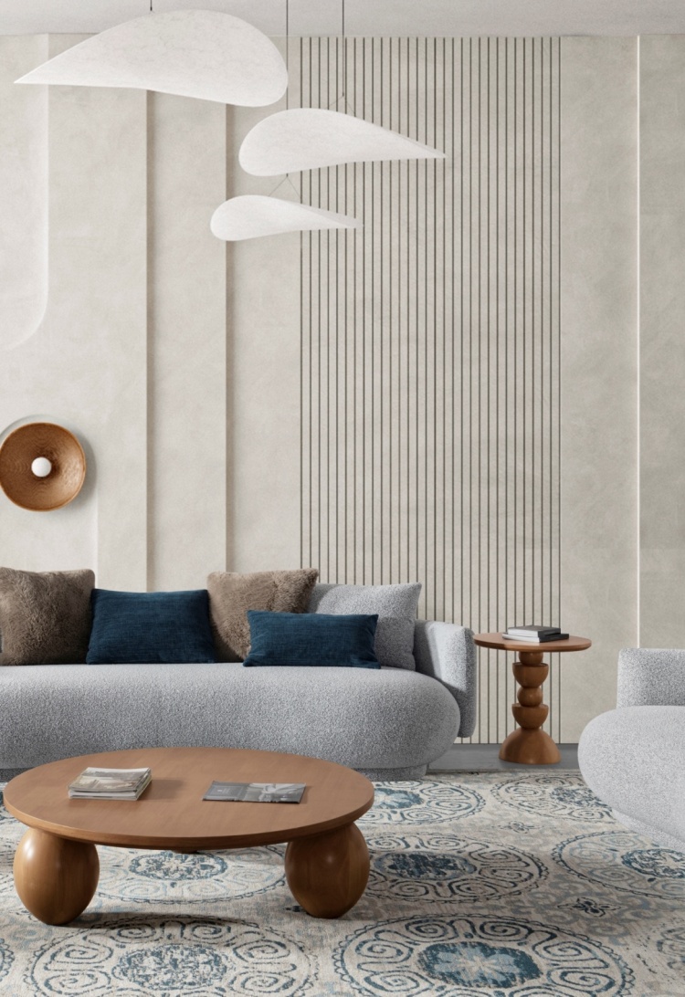 Side view of the curved sofa showing the rounded armrests and wooden side table