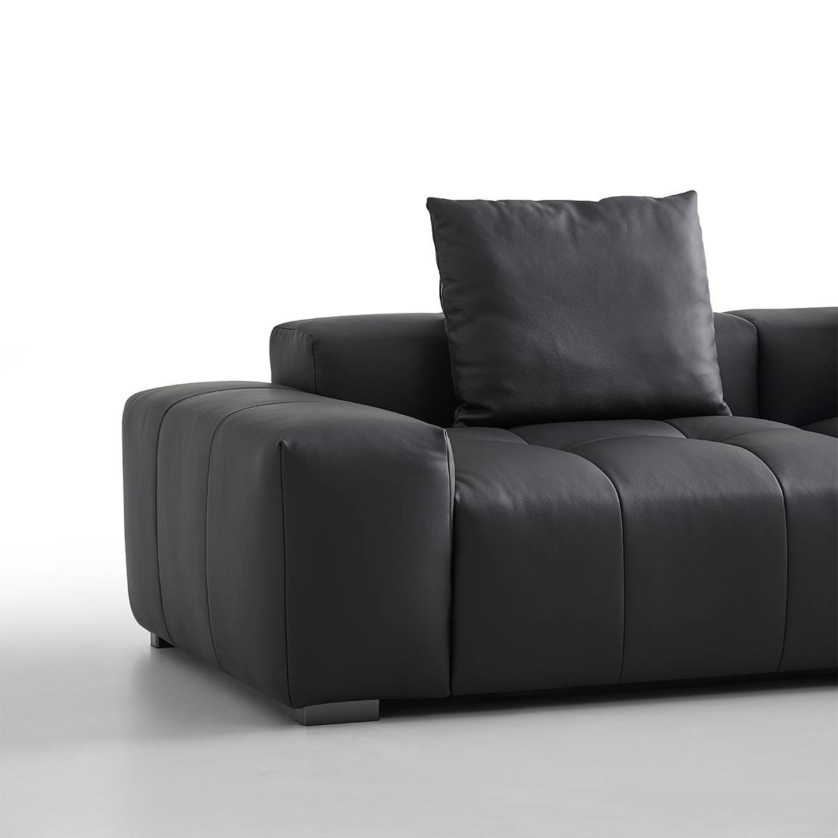 Close-up detail of the sofa armrest and cushion texture