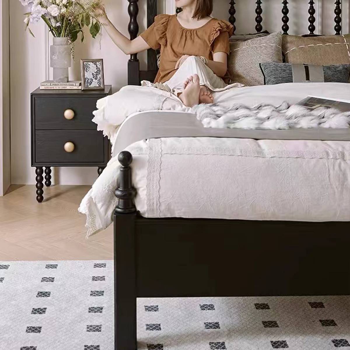 Close-up of the footboard and side profile of the bed frame