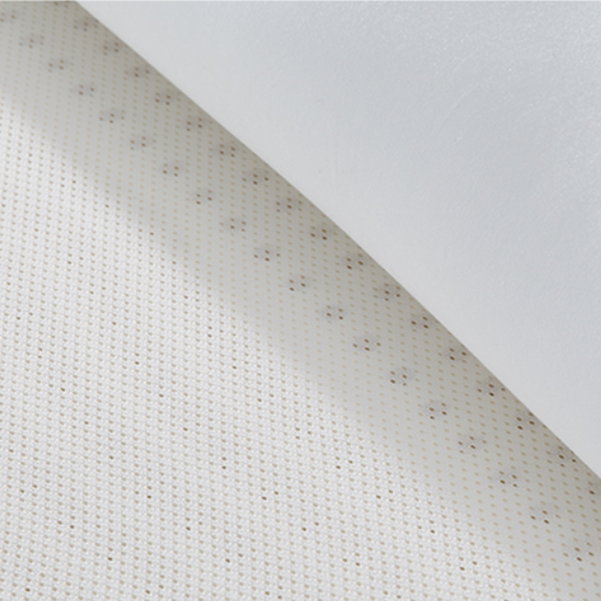 Close-up of the mattress fabric texture showing the anti-mite material