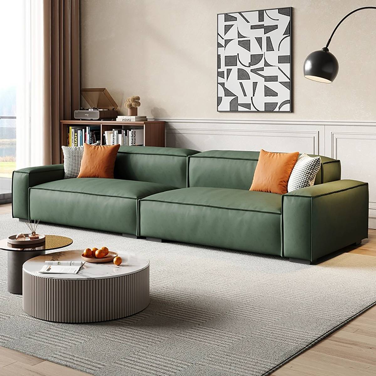 Green modular block sofa with orange accent pillows