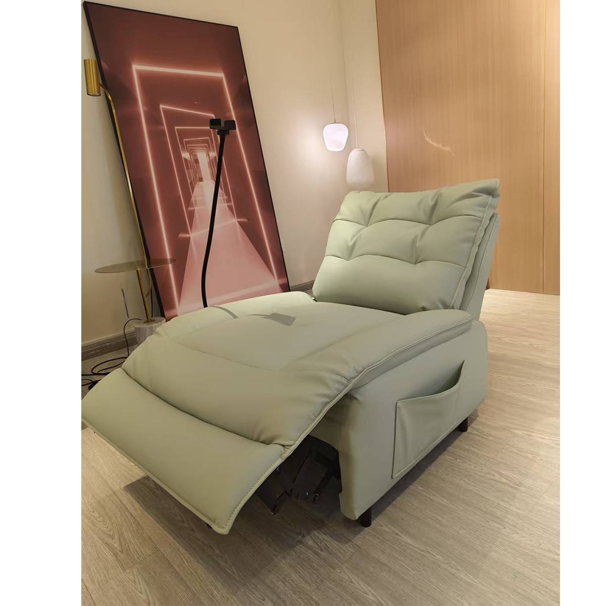 The recliner chair in a fully reclined position showing the extended footrest