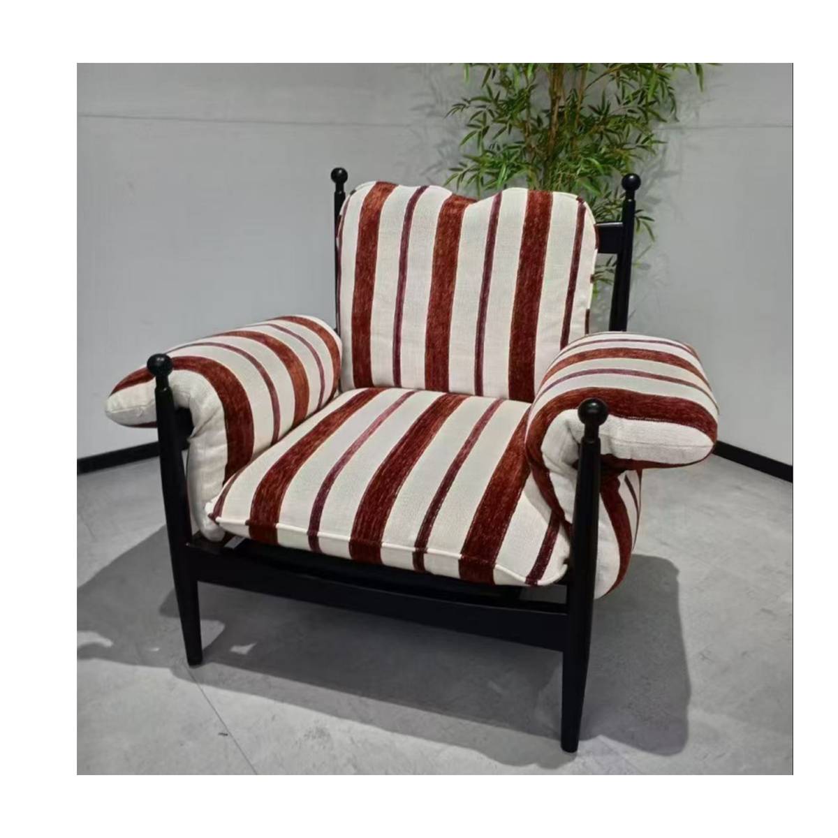 Studio shot of the striped lounge chair against a white background